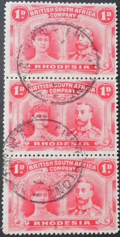 Rhodesia Double Head One Penny strip with OD flaw and LIVINGSTONE (DC) postmark